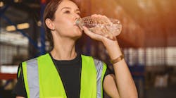 664420310dafe73525fb8ade Woman Drinking Water In Warehouse