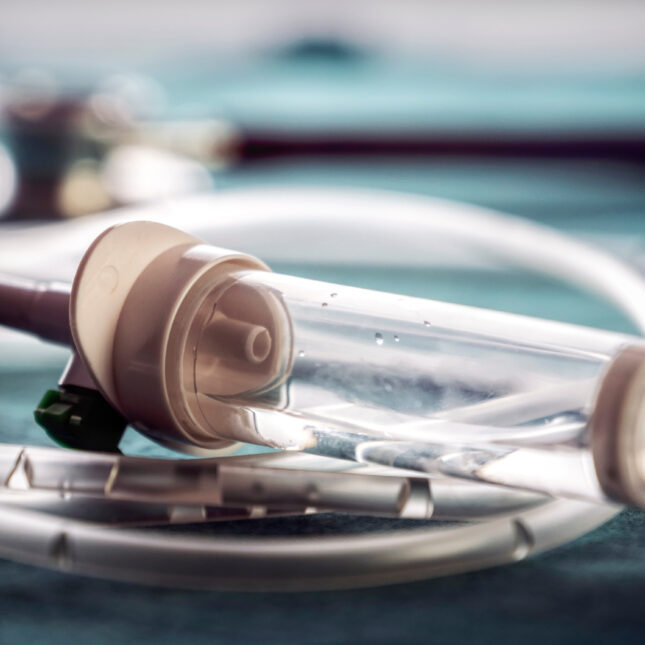 Close up stock photograph of Intravenous medicine equipment sitting empty on a medical tray to represent that there is a shortage of pain medication