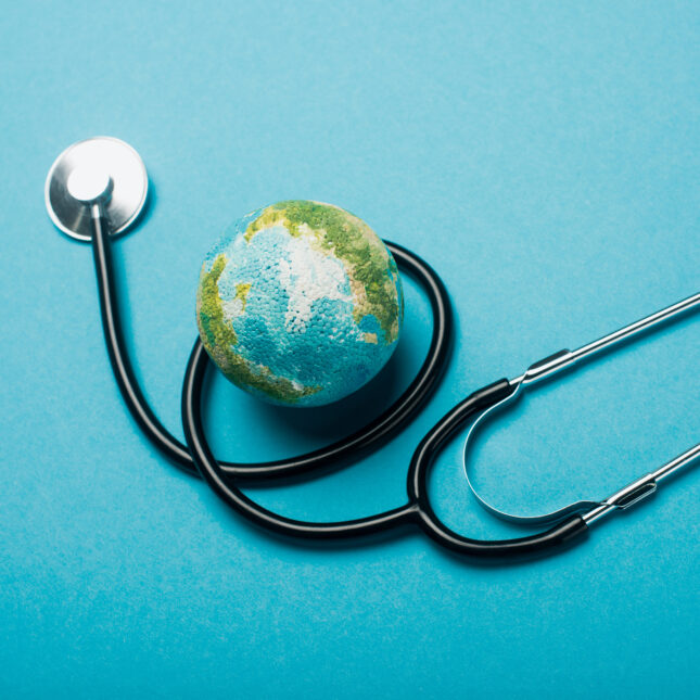 Globe and stethoscope on blue background -- first opinion coverage from STAT