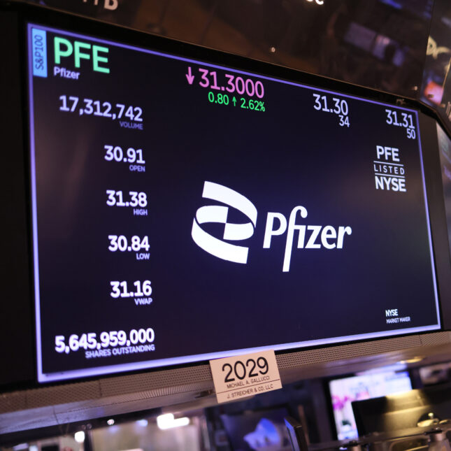 The Pfizer company logo is displayed on a screen at the New York Stock Exchange. -- biotech coverage from STAT