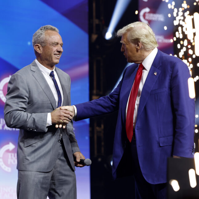 Robert F. Kennedy Jr. smiles as he shakes Donald Trump's hand on stage -- coverage from STAT